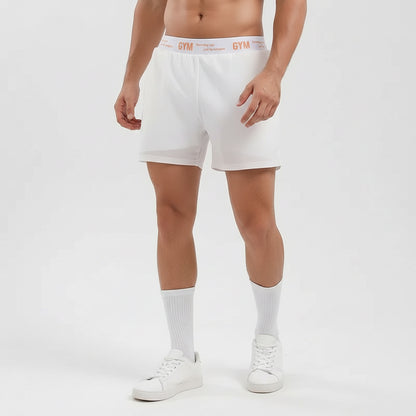 Person wearing white gym shorts with 'Gym' branding on a plain background