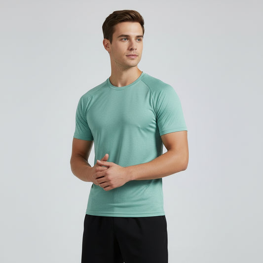 Man wearing a light green t-shirt against a plain background