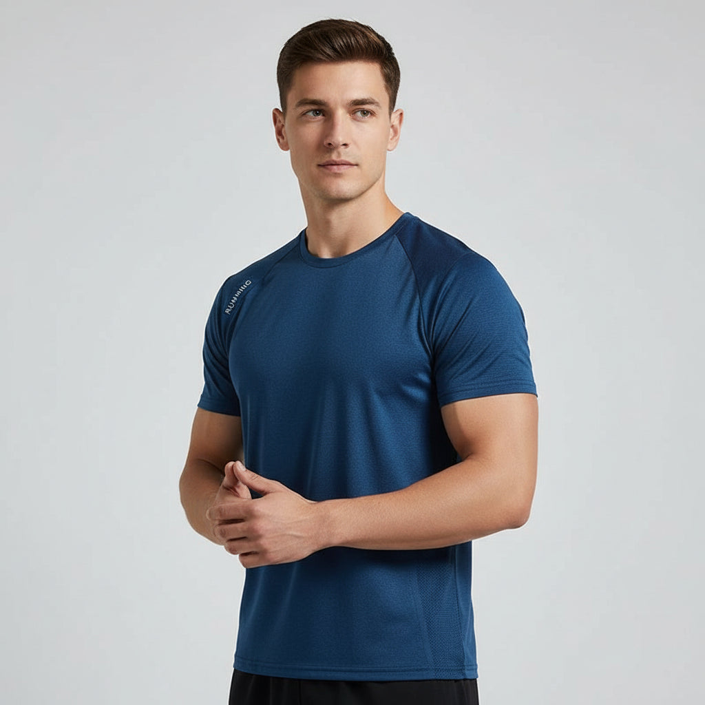 Man wearing a blue athletic shirt on a light gray background