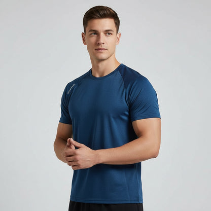 Man wearing a blue athletic shirt on a light gray background