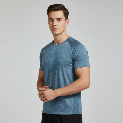 Man wearing a blue athletic shirt on a gray background