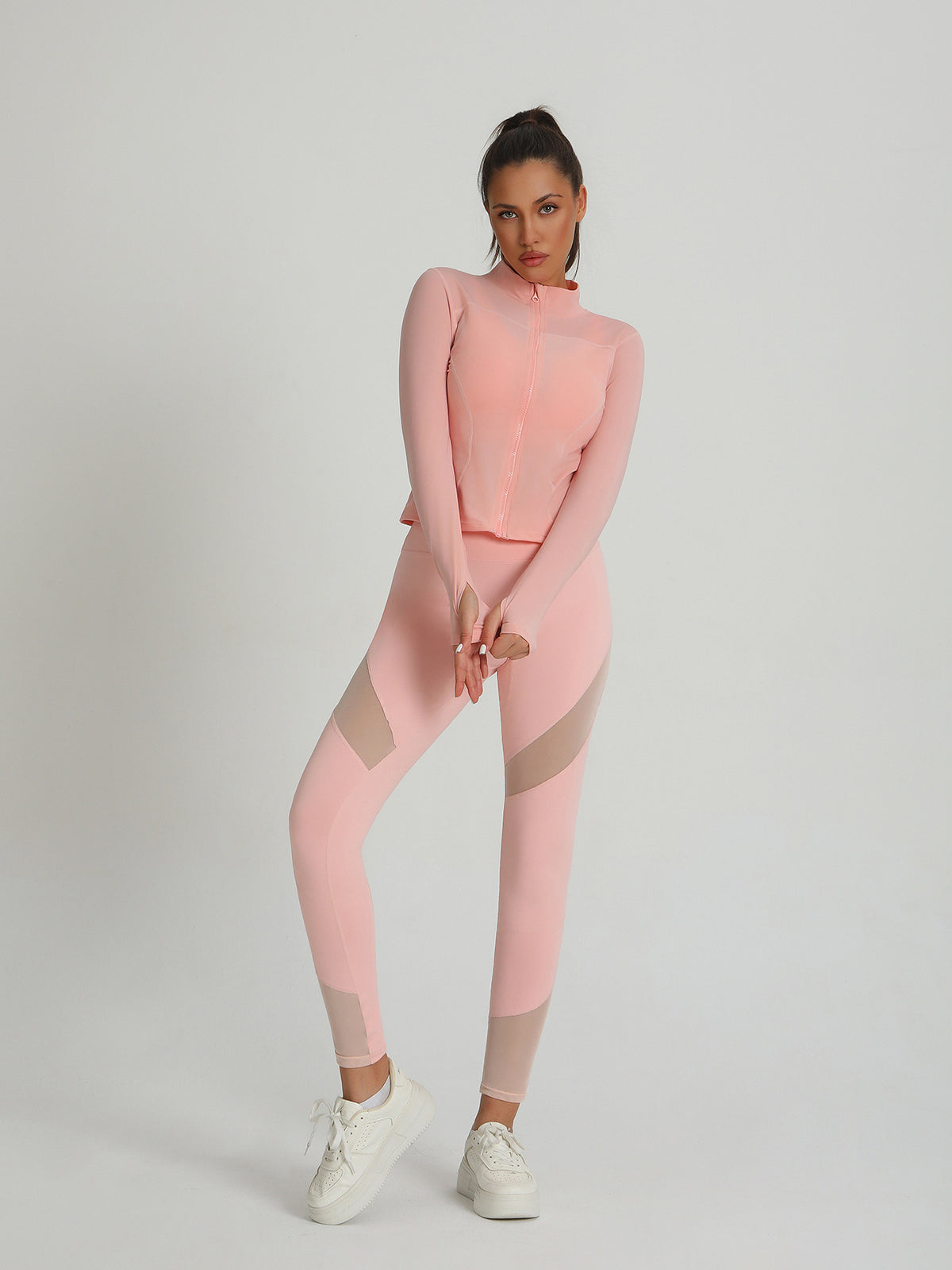 Peach-pink long-sleeve zip active set with leggings and contrast mesh panels on thighs
