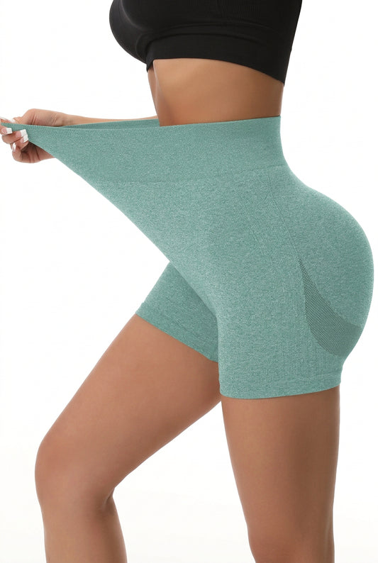 High-waisted seamless yoga shorts in green, front view, wide stretchy waistband