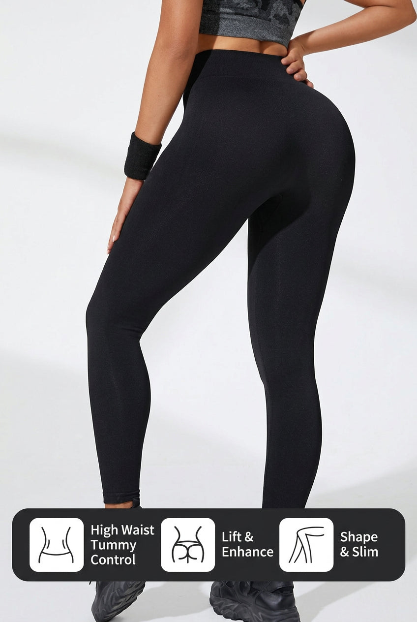 Black high-waisted leggings with contoured waistband and text print on thighs