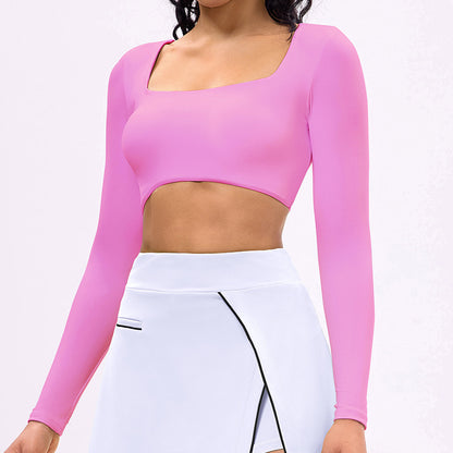 Pink long-sleeve sports crop top with square neckline and white tennis skirt