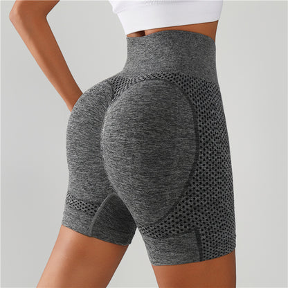 Gray high-waisted gym shorts with textured mesh panels, rear view