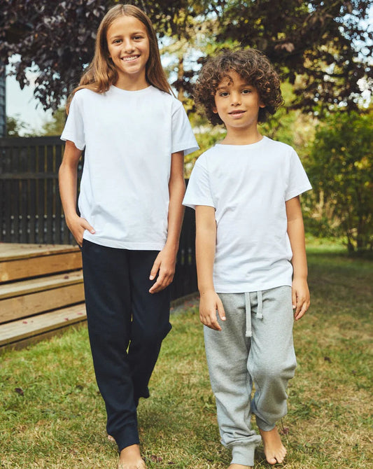 Kids sweatpants in navy blue with elastic waistband and drawstring, tapered cuffs