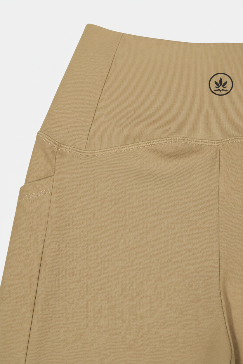 Beige pants with a brand logo on a white background