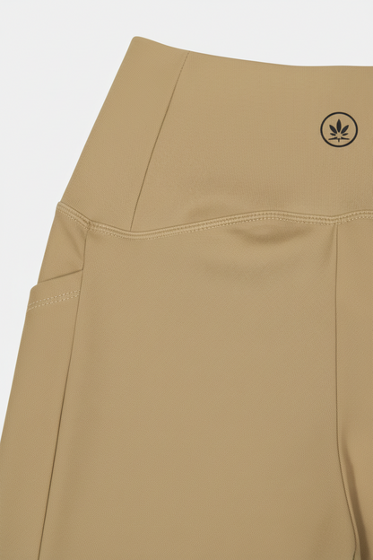 Beige pants with a brand logo on a white background