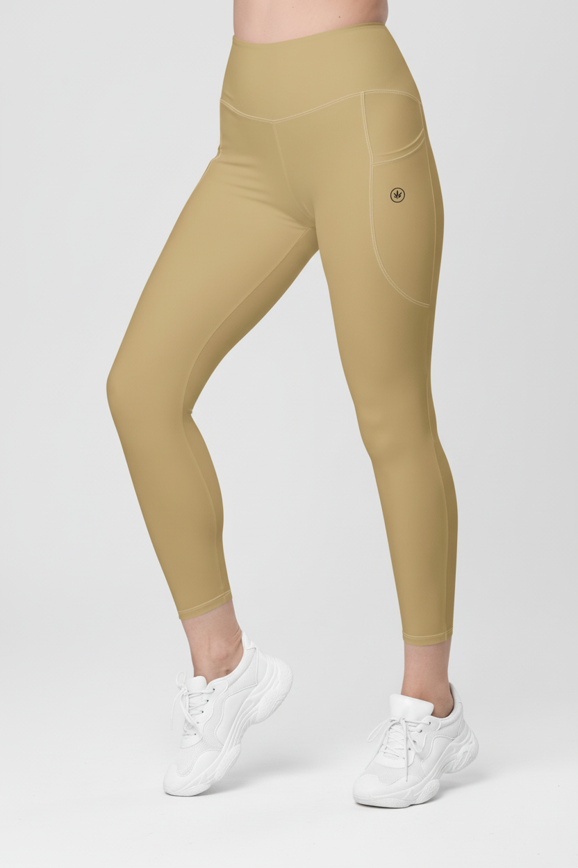 Beige leggings worn by a person on a white background