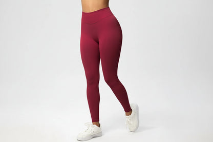 Maroon leggings with a logo on a white background