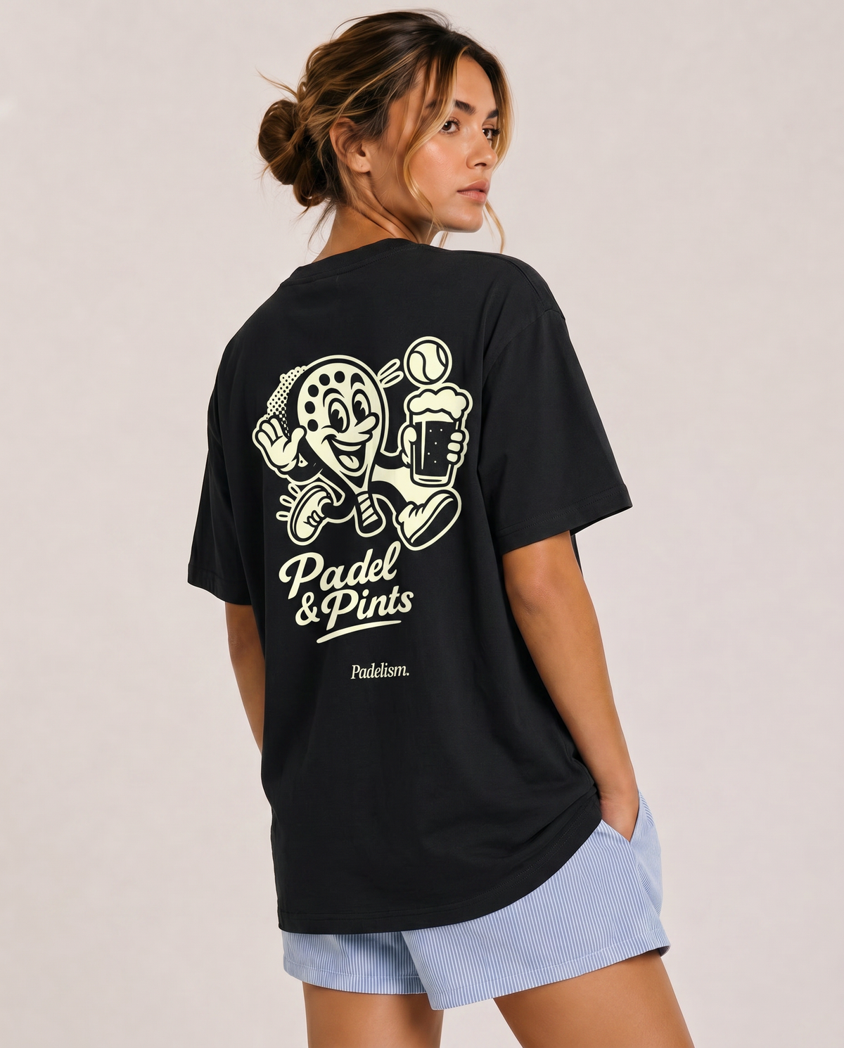 Black heavyweight T-shirt with “Padel & Pints” back graphic