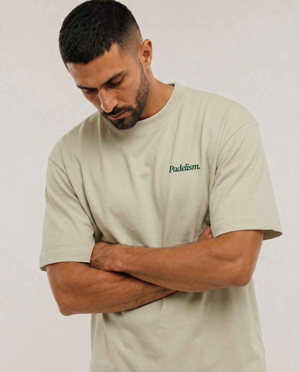 Oat gray heavyweight t-shirt with small “Padelism.” logo on the chest