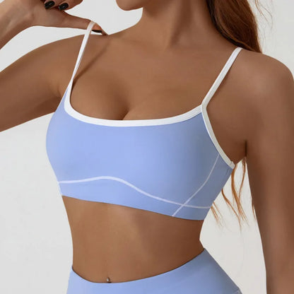 Light blue sports bra worn by a person on a plain background