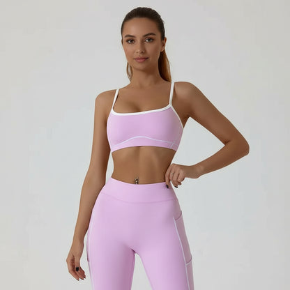 Pink sports bra worn by a person on a white background