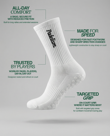 White crew socks with ribbed knit and dotted non-slip grip sole