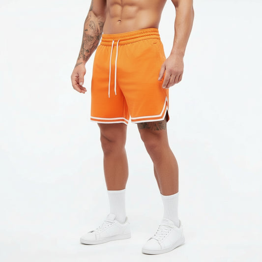 Person wearing bright orange shorts with white drawstring and trim on a white background