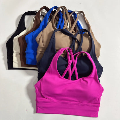 Color assortment of women's cross-back padded sports bras with crisscross straps