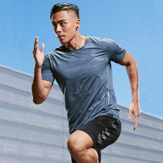 Man running outdoors with a clear blue sky background