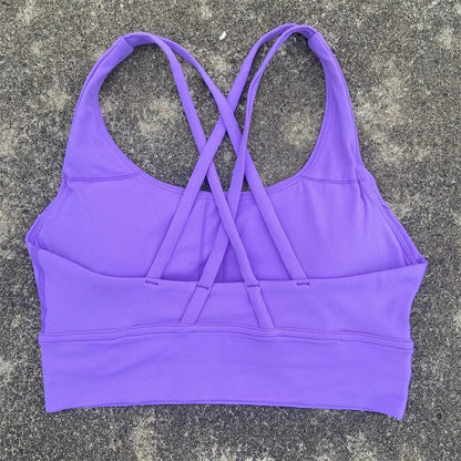 Women's padded cross-back sports bra in violet purple with crisscross back straps