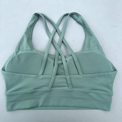 Sage green cross-back padded sports bra with crisscross racer back straps