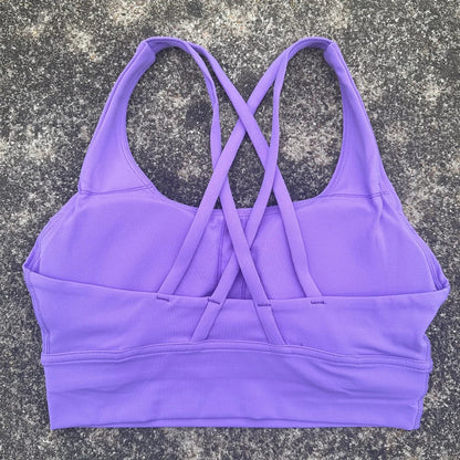 Purple cross-back padded sports bra with crisscross racer back straps