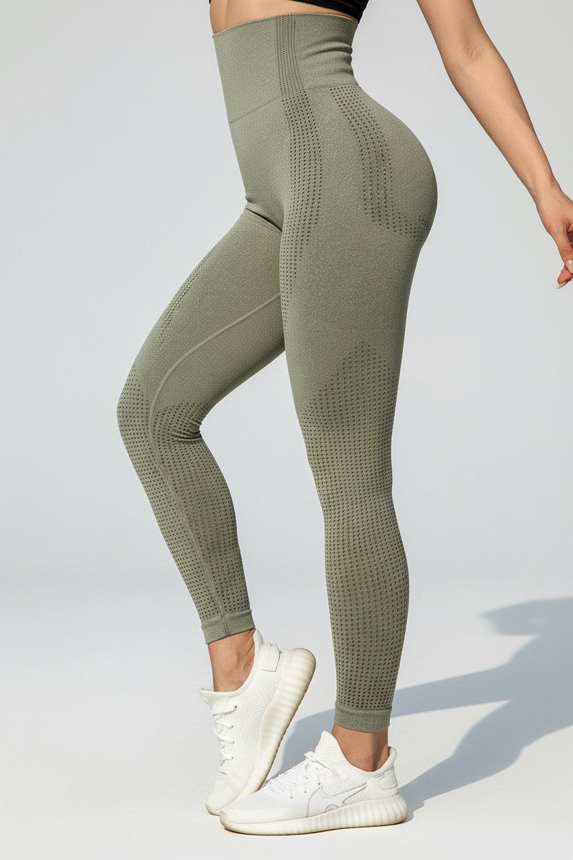 Person wearing green leggings with a blurred background