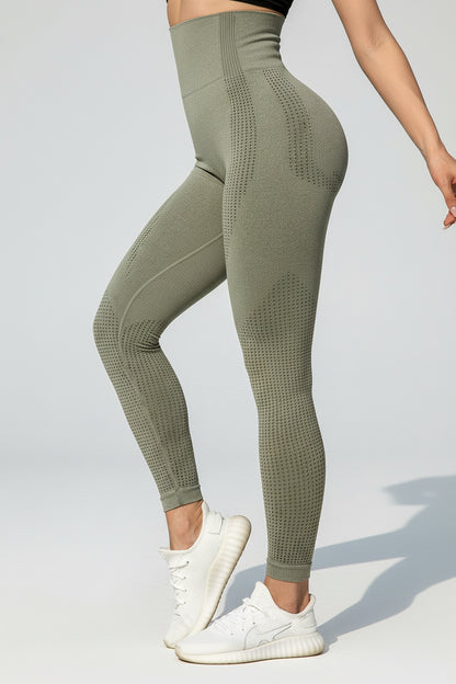 Person wearing green leggings with a blurred background