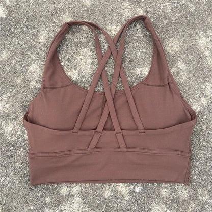 Women's padded cross-back sports bra in cocoa brown with crisscross back straps