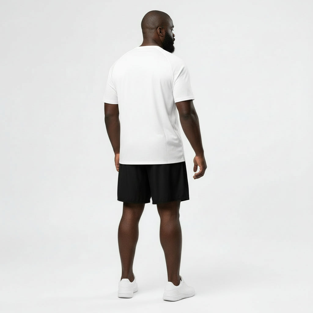Man wearing a white t-shirt with '1983' print and black shorts on a white background