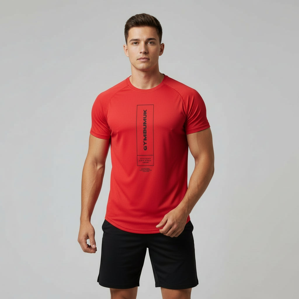 Man wearing a red athletic shirt with a logo on a gray background