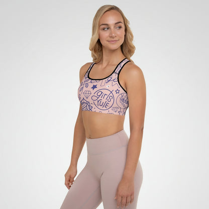 Woman wearing a sports bra with a graphic design and matching leggings on a white background