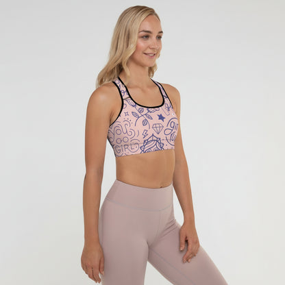 Woman wearing a patterned sports bra and leggings on a white background