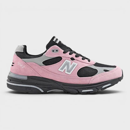 Pink and gray sneakers with New Balance 'N' logo, black lace-up and rubber sole