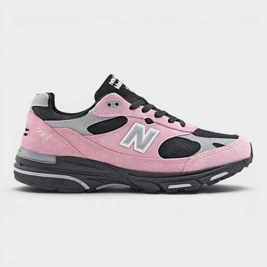 Pink and gray sneakers with New Balance 'N' logo, black lace-up and rubber sole