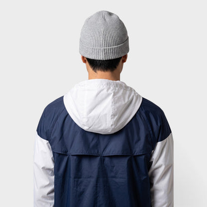 Light grey ribbed beanie worn with short folded cuff