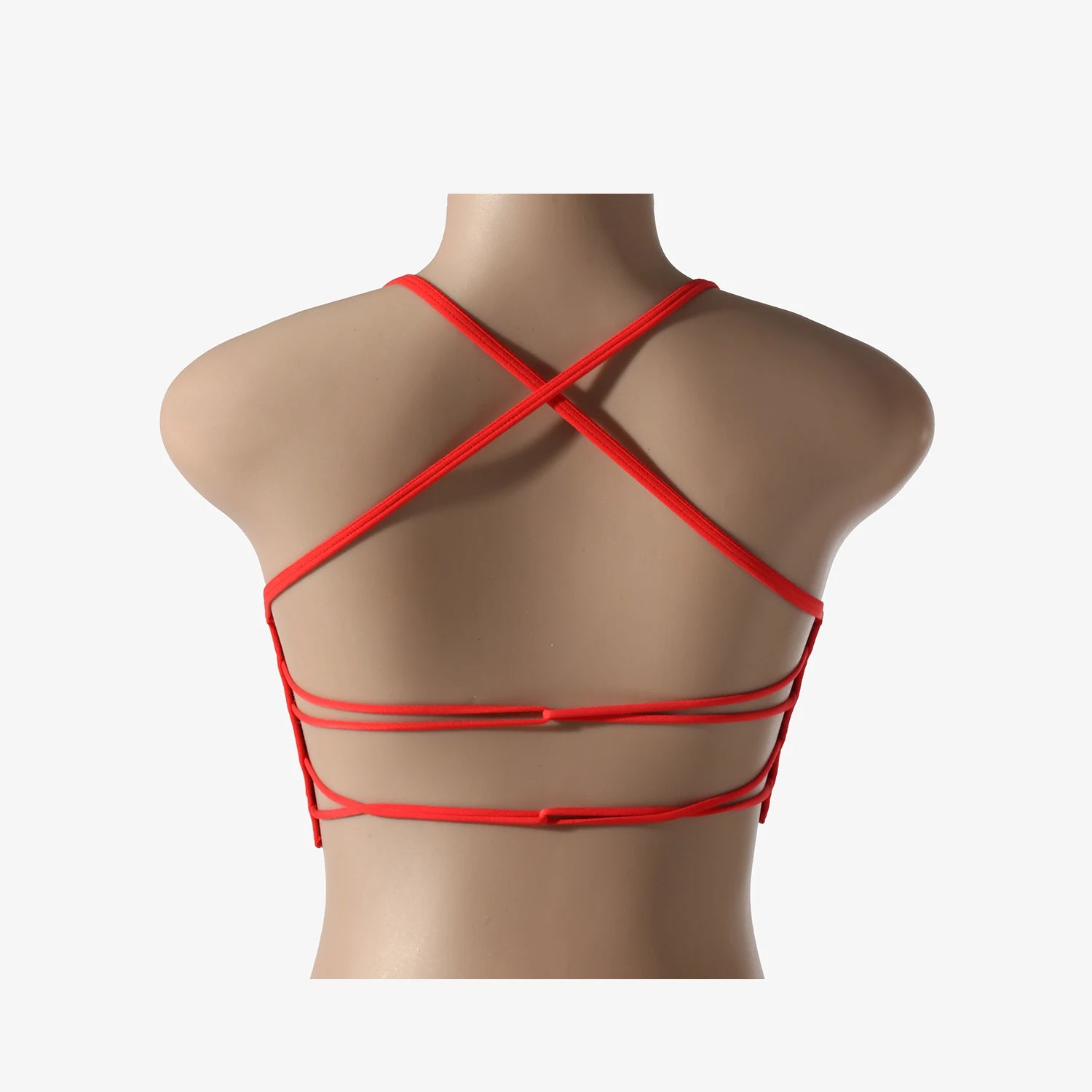 A woman wearing a white seamless sports bra and green Activewear leggings.