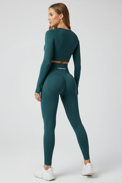 Woman wearing a teal athletic outfit on a white background