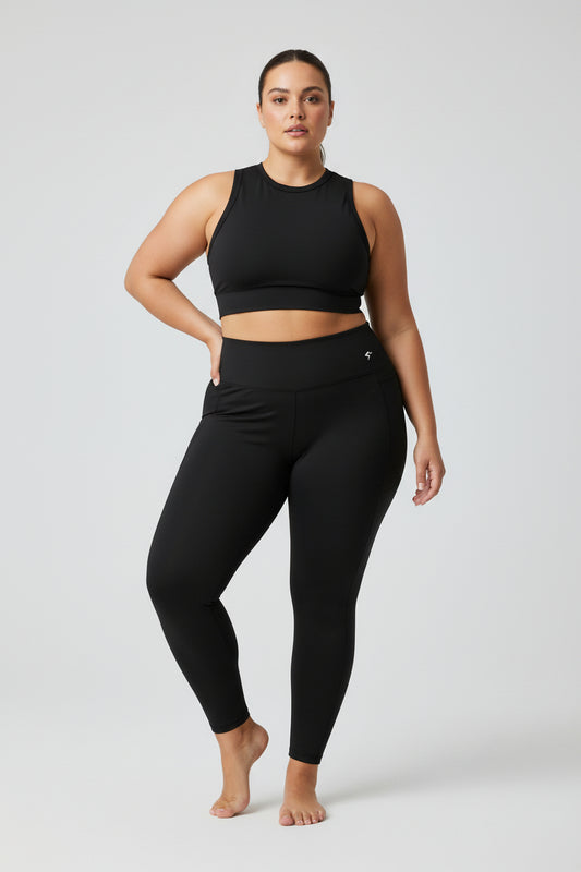 Person wearing a black athletic outfit on a white background