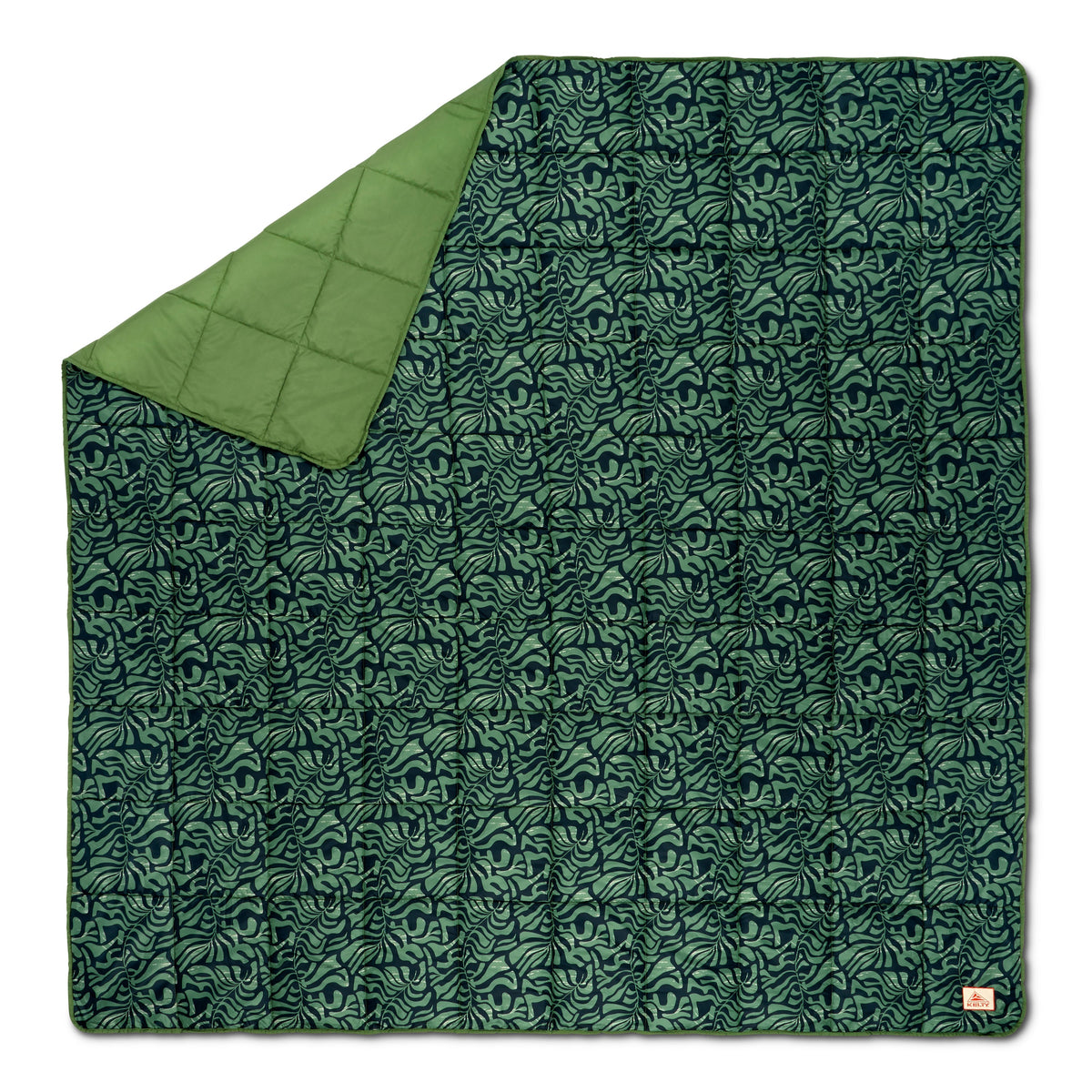 Camping blanket with dark teal leaf pattern and matching green solid reverse side