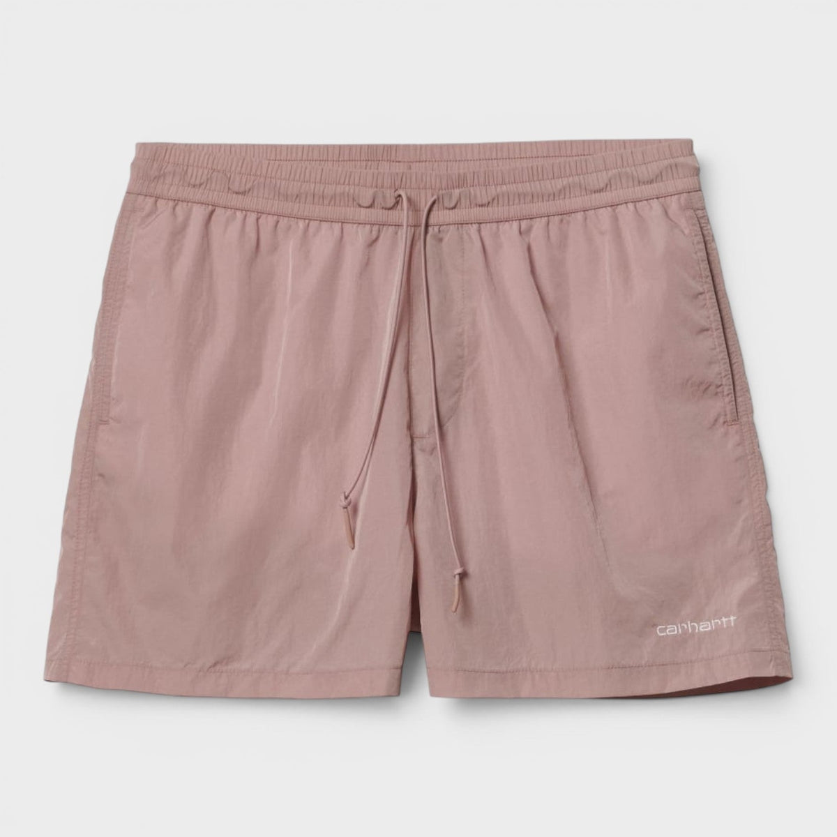 Pink swim trunks with elastic waistband, drawstring, and side logo patch