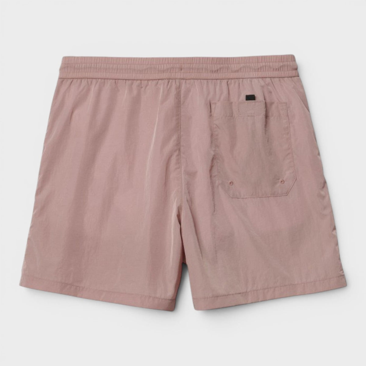 Pink swim trunks with elastic waist and side cargo pocket, black logo tag