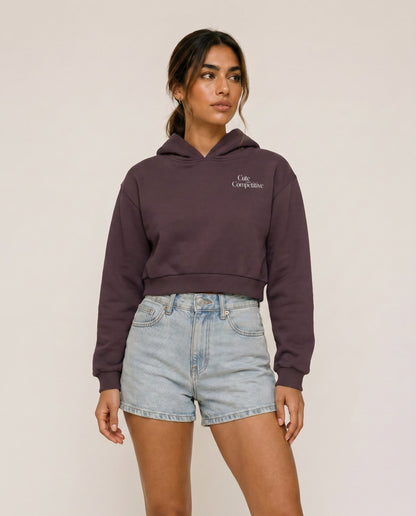Dark purple cropped hoodie with hood, front logo, and kangaroo pocket