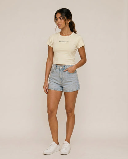 White cropped T-shirt with small chest logo text