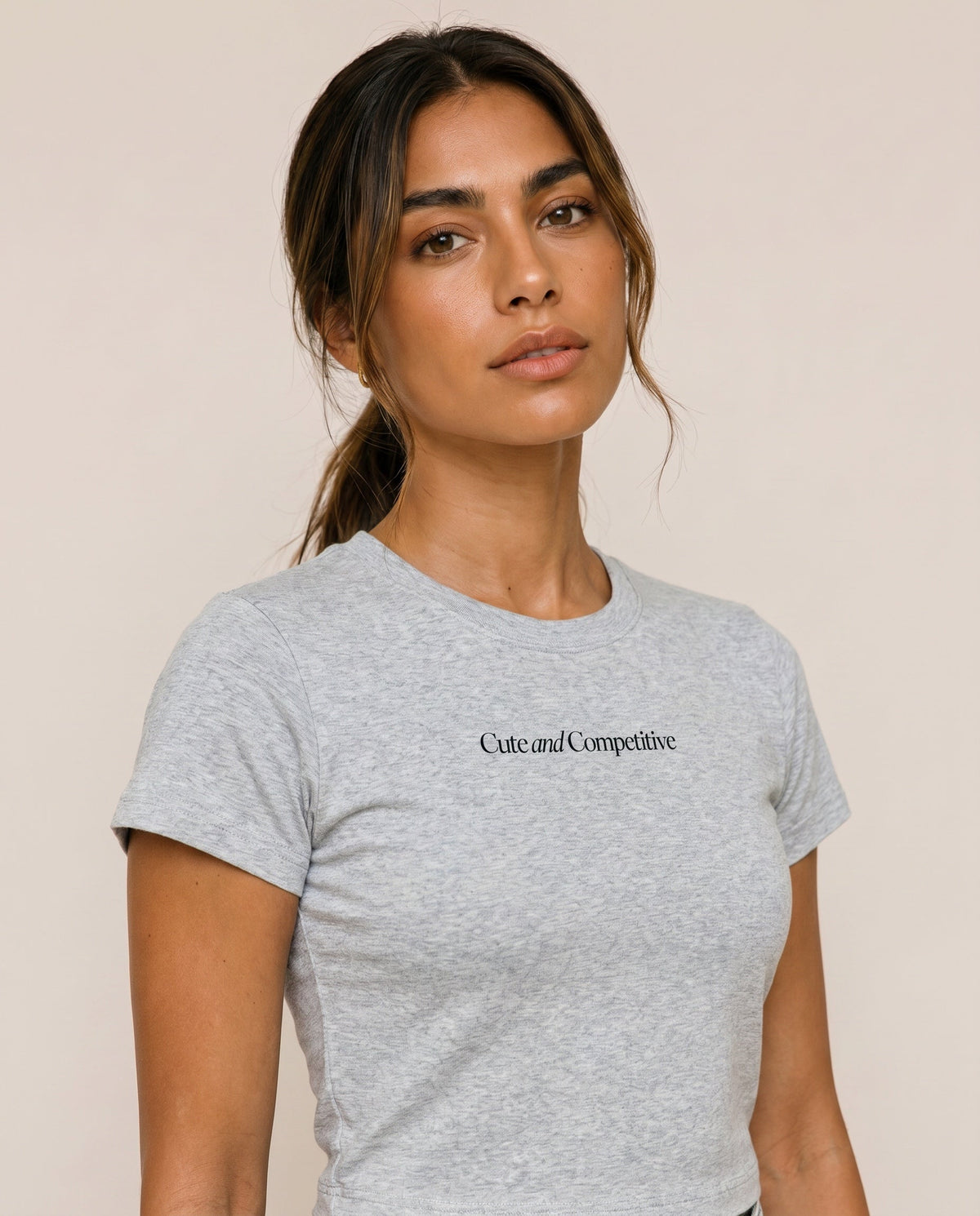 Light gray cropped T-shirt with crew neck and chest logo