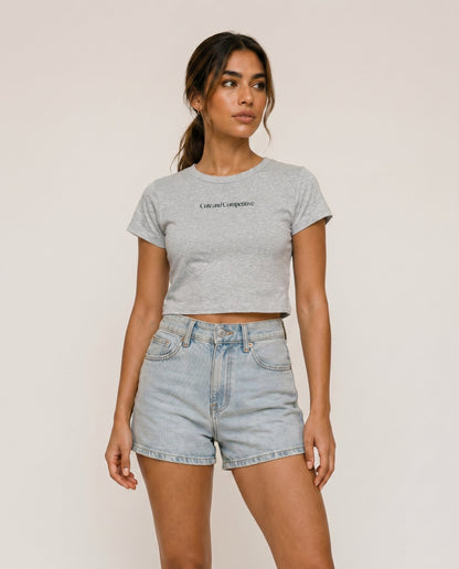 Cropped gray T-shirt with crew neck and short sleeves; small chest slogan print