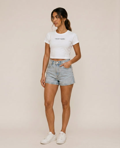 Cropped white T-shirt with crew neck and short sleeves; small chest logo print