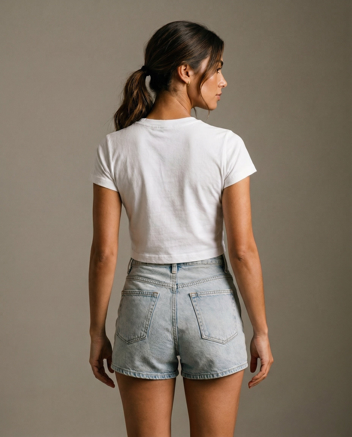 Cropped white T-shirt with crew neck and short sleeves; back view