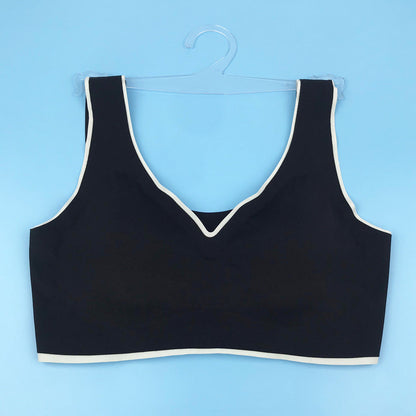 Seamless underwire-free bra in black with V-neck and contrast light trim