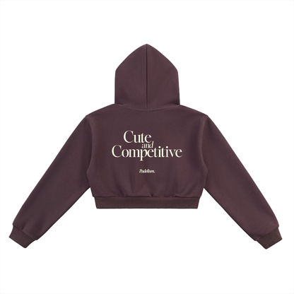 Cropped maroon hoodie back view with hood and large "Cute and Competitive" text